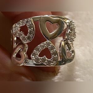 925  Sterling Silver adorned with heart motifs, perfect for any occasion. Size 7